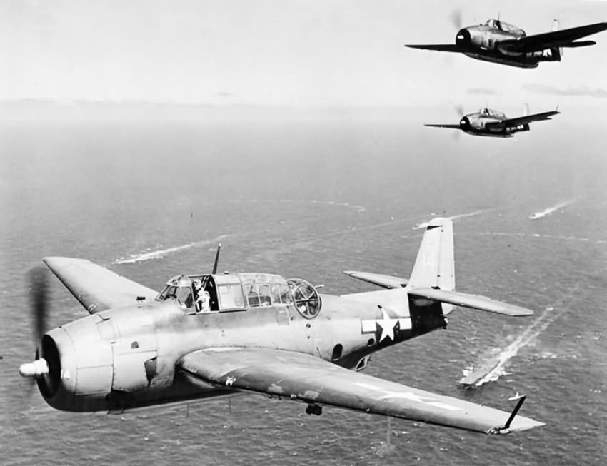 TBF Avengers fly over ships of the fleet en route to bomb enemy targets on September 26 1944