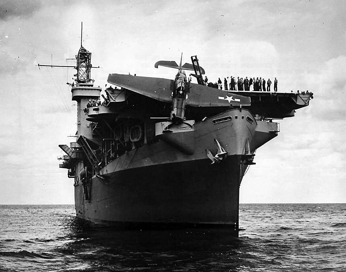 TBF Avenger hangs on carrier s bow after overrunning flight deck