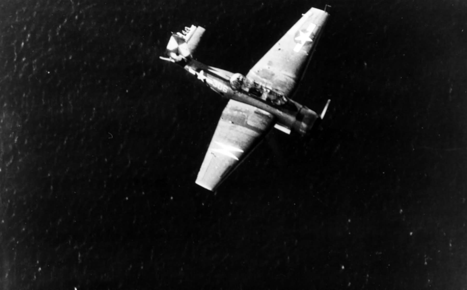 TBF Avenger prepares for a water landing near a destroyer during the Okinawa invasion