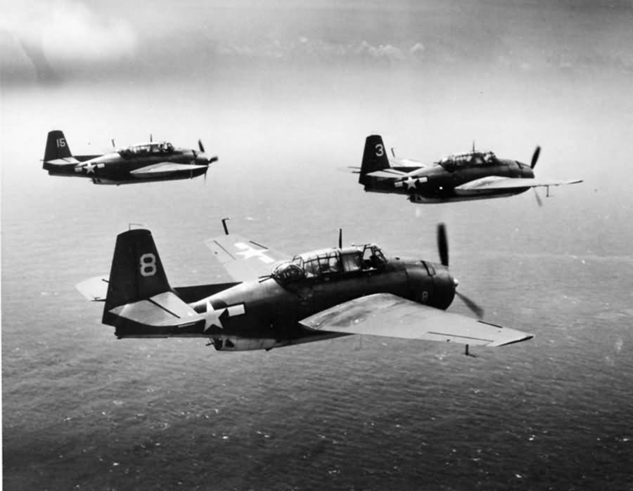 TBM-1C Avengers #8, 3, 15 of VT-7 off the carrier USS Hancock CV-19 in flight over the Pacific August 5, 1944