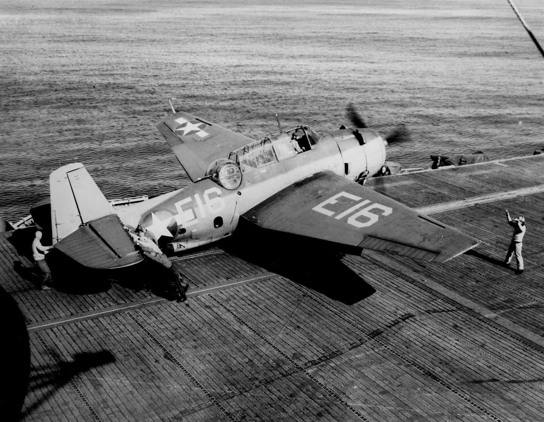 TBM Avenger code E16 of Carrier Aircraft Service Unit CASU-22 onto catapult on board the escort carrier USS Mission Bay (CVE-59) on October 23, 1943