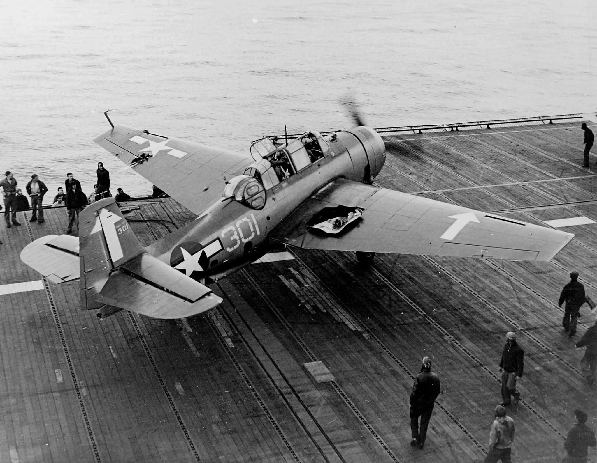 Damaged TBM-3 #301 of VT-84 after it landed aboard the carrier USS Bunker Hill (CV-17) February 19, 1945