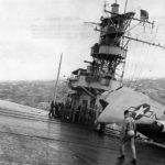 TBF Avenger on deck of carrier moving thru heavy seas