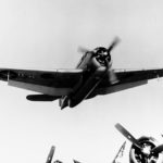 TBM-1 Avenger flies low over the flight deck of USS Makin Island