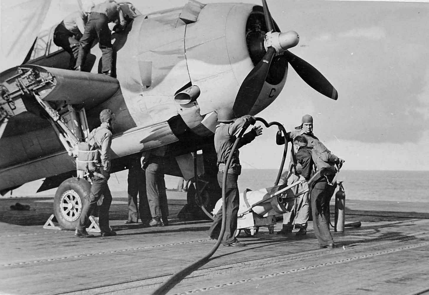 refuel a TBF-1 Avenger of VT-4 on the flight deck of the USS Ranger during Operation Torch November 8 1942