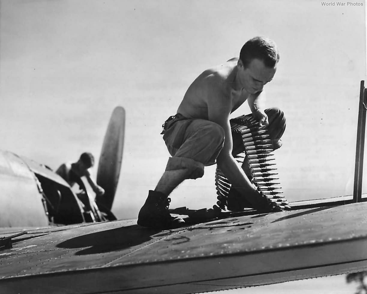 Marine ground crewman loads ammo