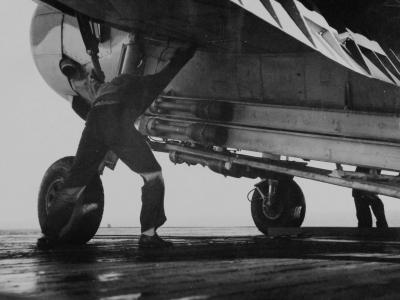 TBF with rocket bombs in rack ready to be catapulted from USS Mission Bay 26 November 1943