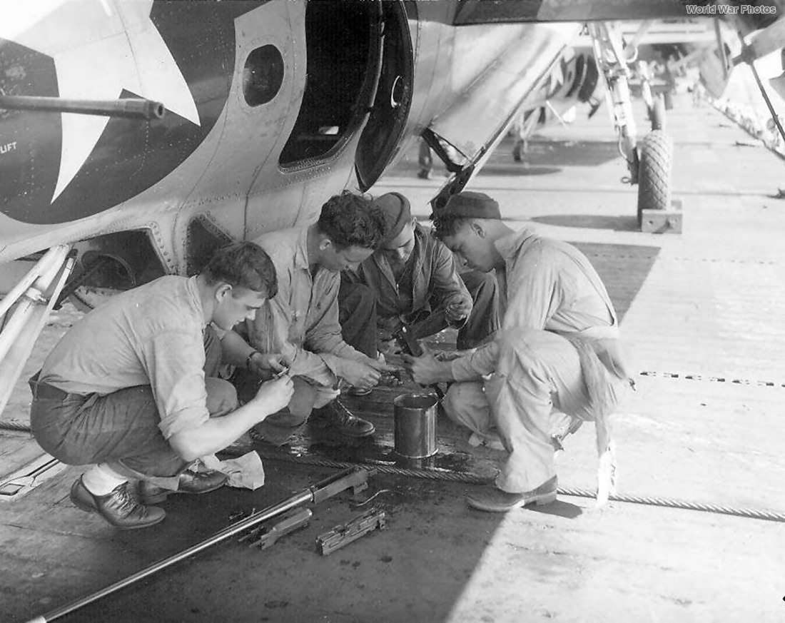 VT-24 personnel at work on the flight deck of the USS Santee in 1945