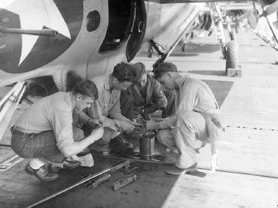 VT-24 personnel at work on the flight deck of the USS Santee in 1945