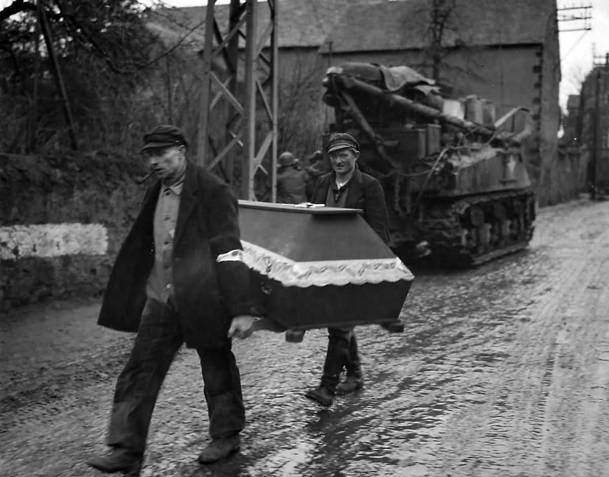 M32 ARV and 3rd Army Troops Pass Germans Carrying Coffin near Coblenz 1945