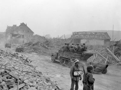 1st Army MP and M3 Halftracks with trailers in Ruins of Alterkirchen Germany 1945