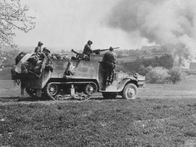 GIs in M3A1 half track attack near Wiezemburg Germany 1945