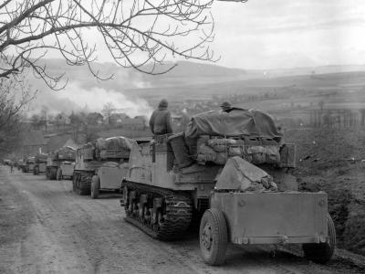 11h Armored Division M7B1 Priest Battery Rolls into Burning Obernust Germany April 1945
