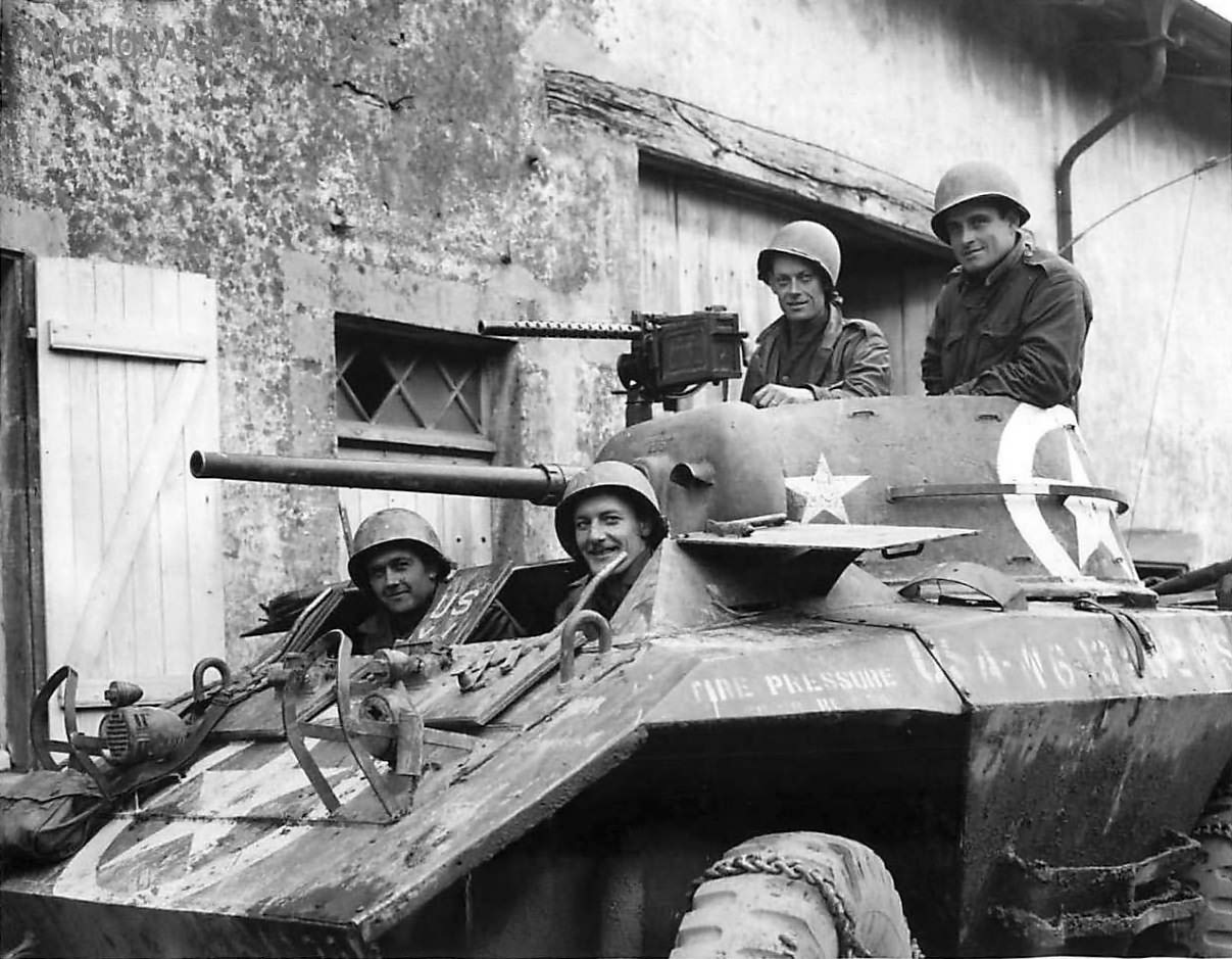U.S. soldiers in M8 of the 106th Cavalry Regiment in small French village 2