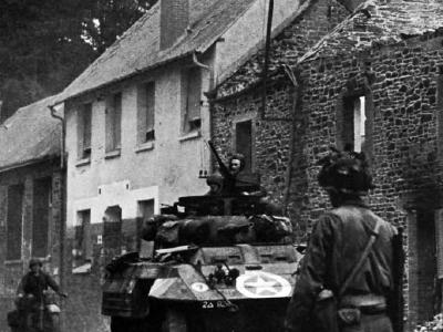 M8 Greyhound of the 82nd Armored Reconnaissance Battalion at St. Lo