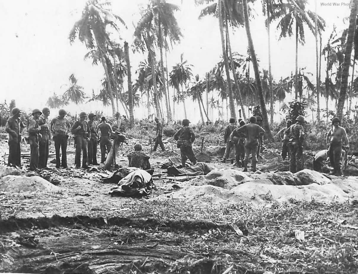 Marines dig graves to bury their Dead on Bougainville