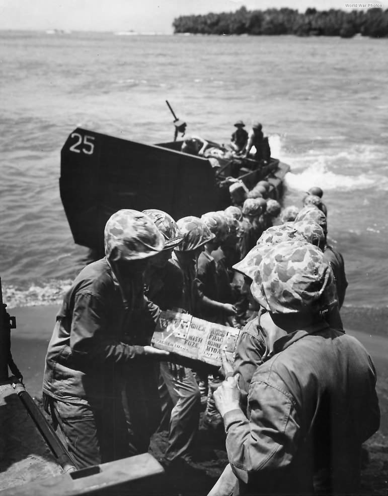 Marines unload ammo from LCV onto Bougainville Beach