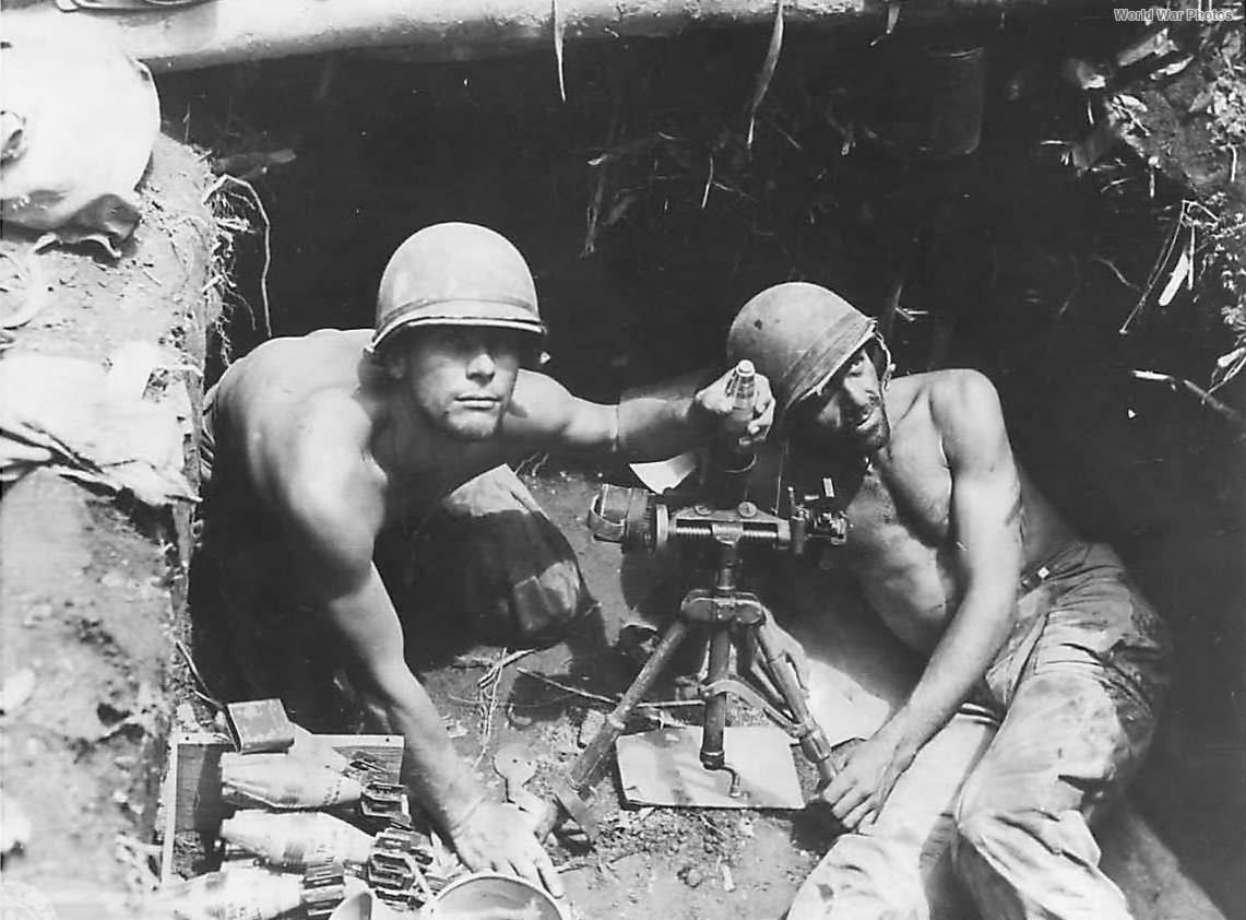 Soldiers of the 23rd Infantry Division manning an M2 60mm light mortar