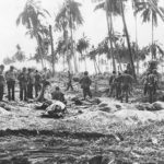 Marines dig graves to bury their Dead on Bougainville