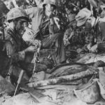 Wounded Marine Raider gets blood plasma on Bougainville 1943