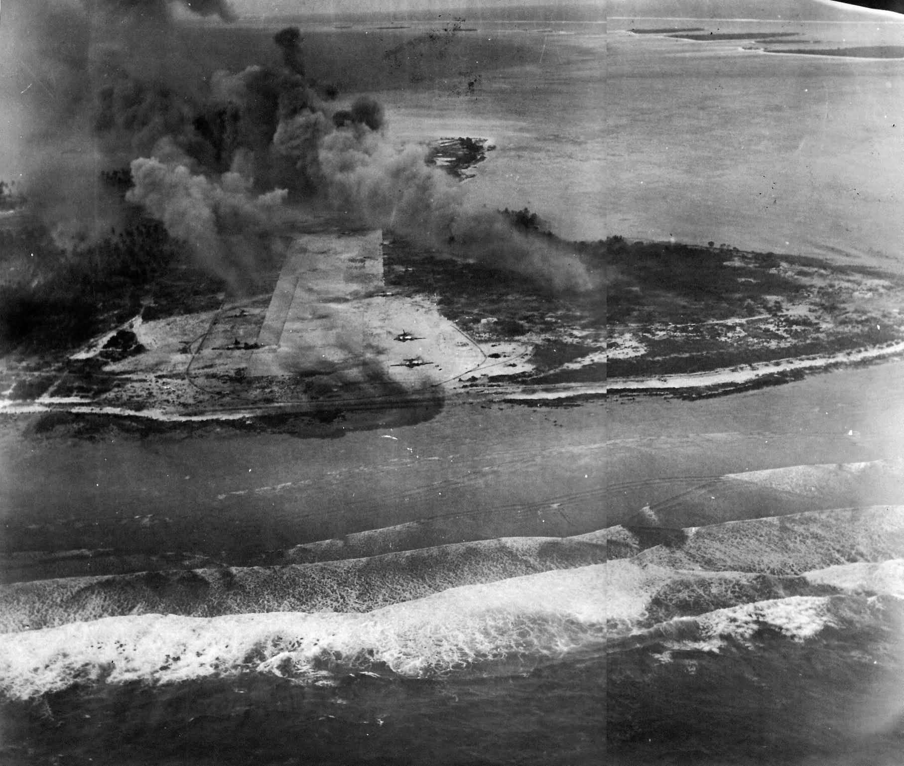 Smoke rises from Eniwetok after attacks by US Navy carrier aircraft 3 February 3 1944