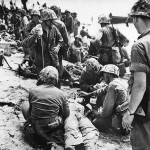 Marines Give Plasma to Wounded Soldier on Eniwetok Pacific