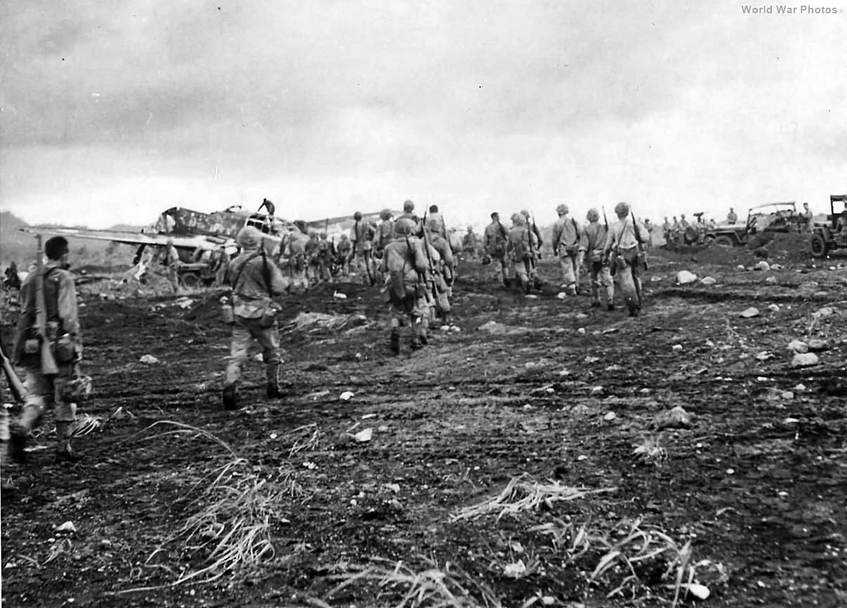 Marine and wrecked Japanese plane at Cape Gloucester Airport