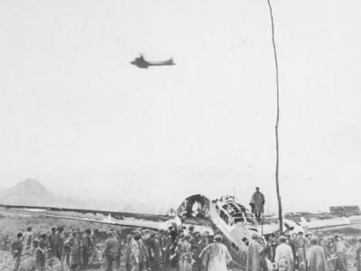 Marine and wrecked Japanese plane at Cape Gloucester airfield