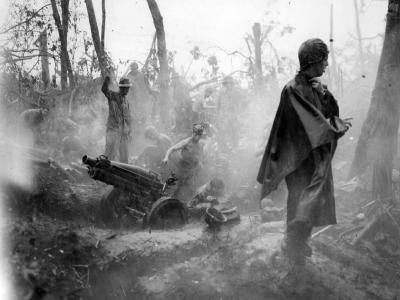 Marines manning 75mm howitzer in rain on Cape Gloucester