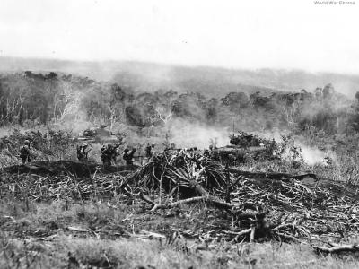 Marines move to Airfield behind tanks on Cape Gloucester