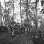Marine Division band salutes comrades on Cape Gloucester