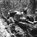 Marines move 105mm howitzer thru mud on Cape Gloucester