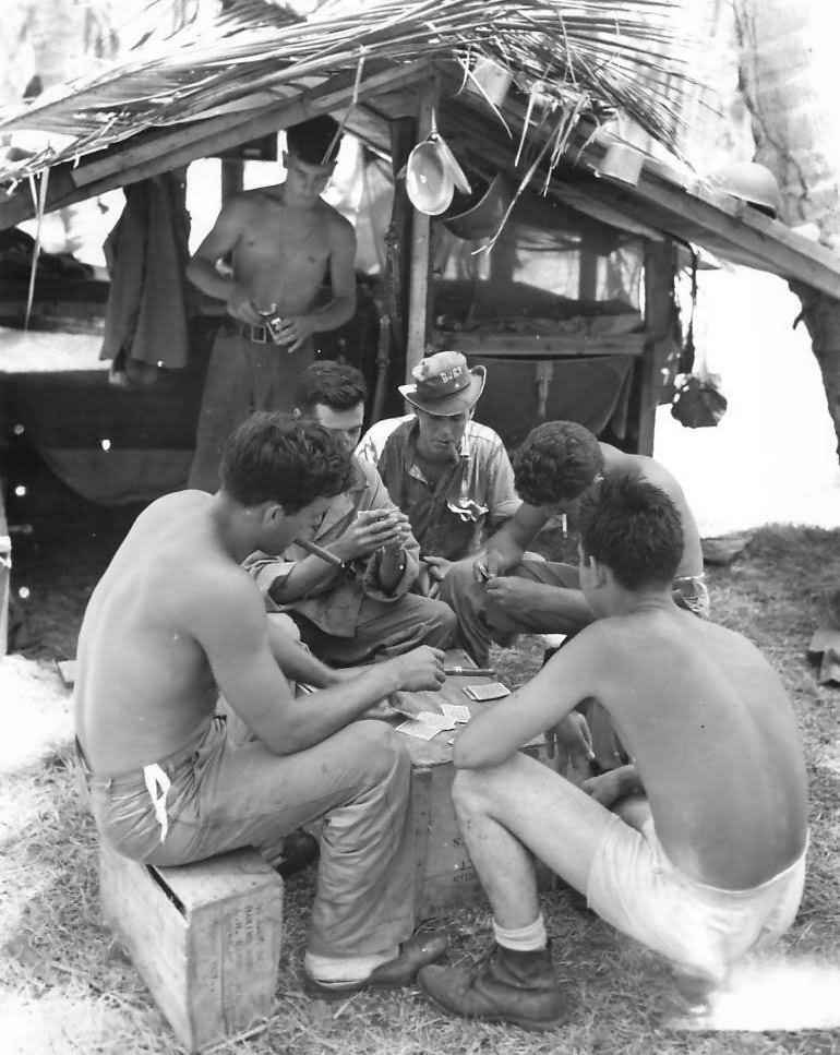 Marines Playing Cards Beside Hut on Guadalcanal 1942