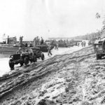 Marines Jeeps and landing barges on Guadalcanal Beach 1942