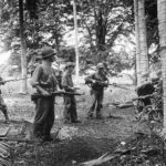 Marines search for Japanese snipers on Guadalcanal 1942