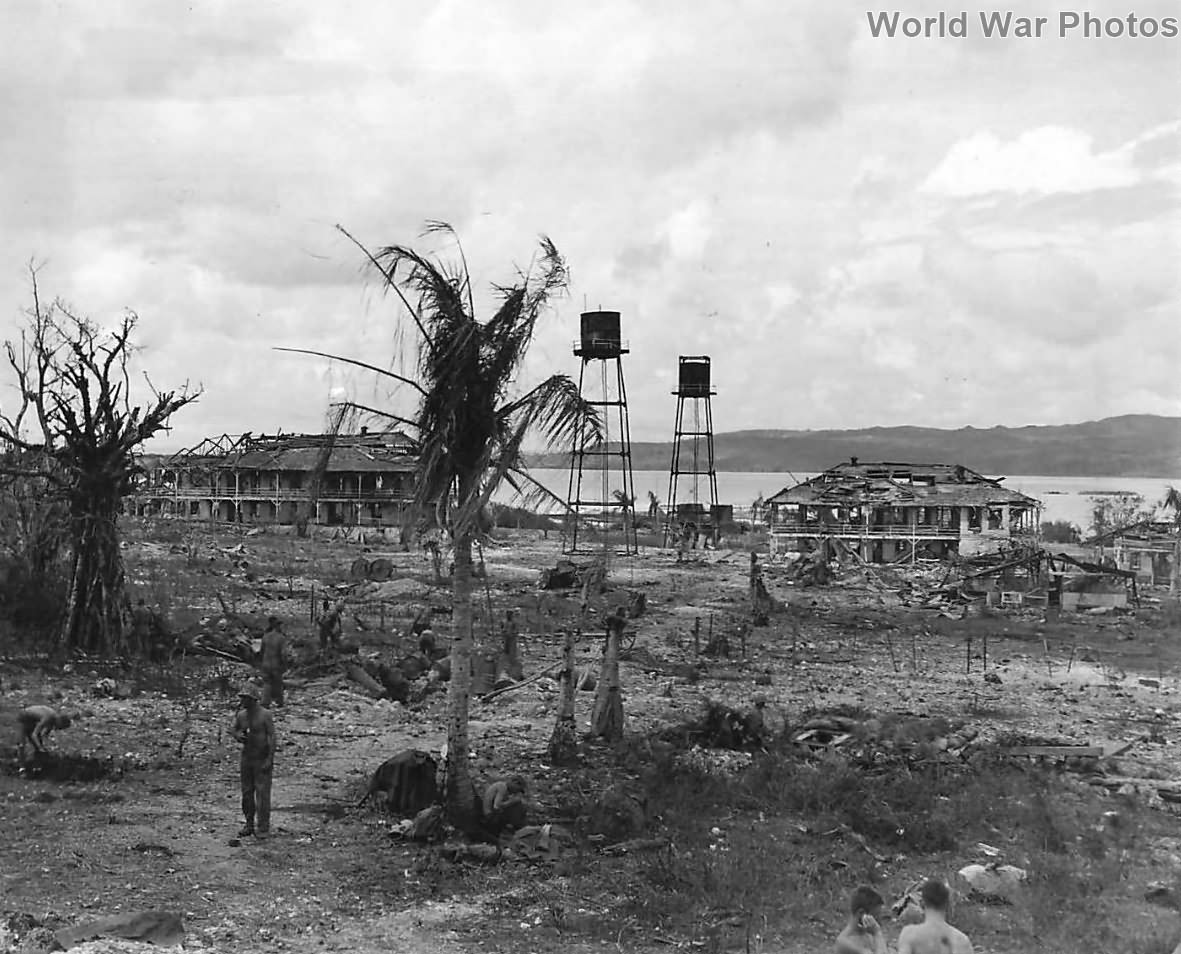 Marines amid the wreckage of the Pacific Cable Company’s office at Sumay