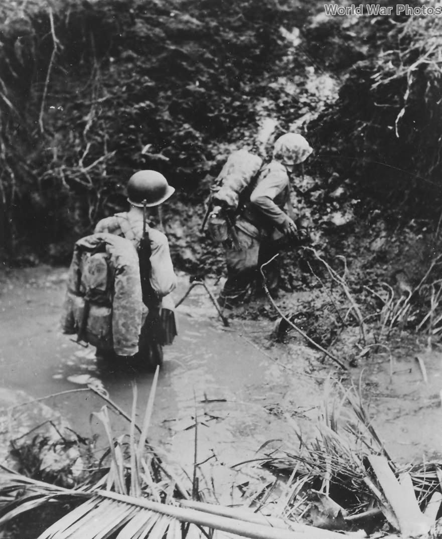 Marines crossing stream