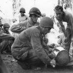 Doctors treat wounded Marines at front line aid station on Guam
