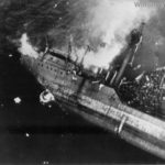 Japanese crew going over side as Kitsugawa Maru sinks at Apra Harbor 1944