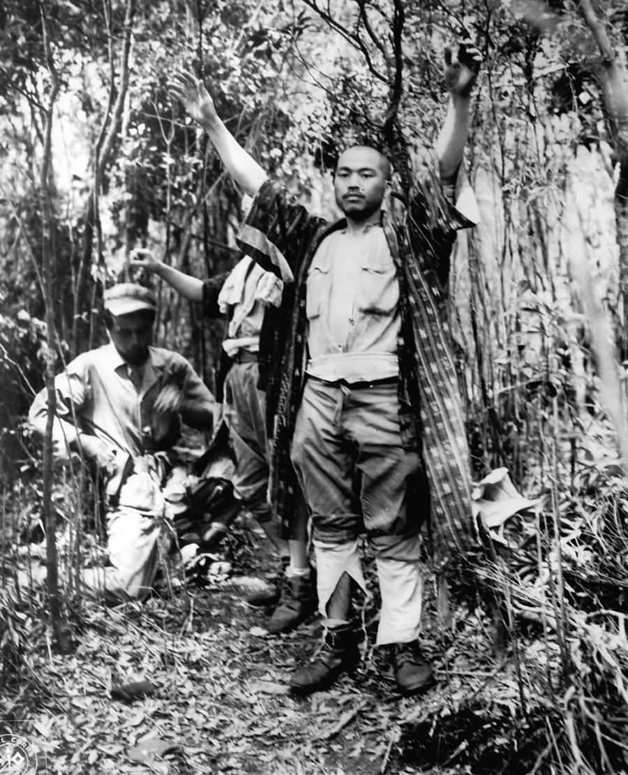 3 Japanese being captured during battle