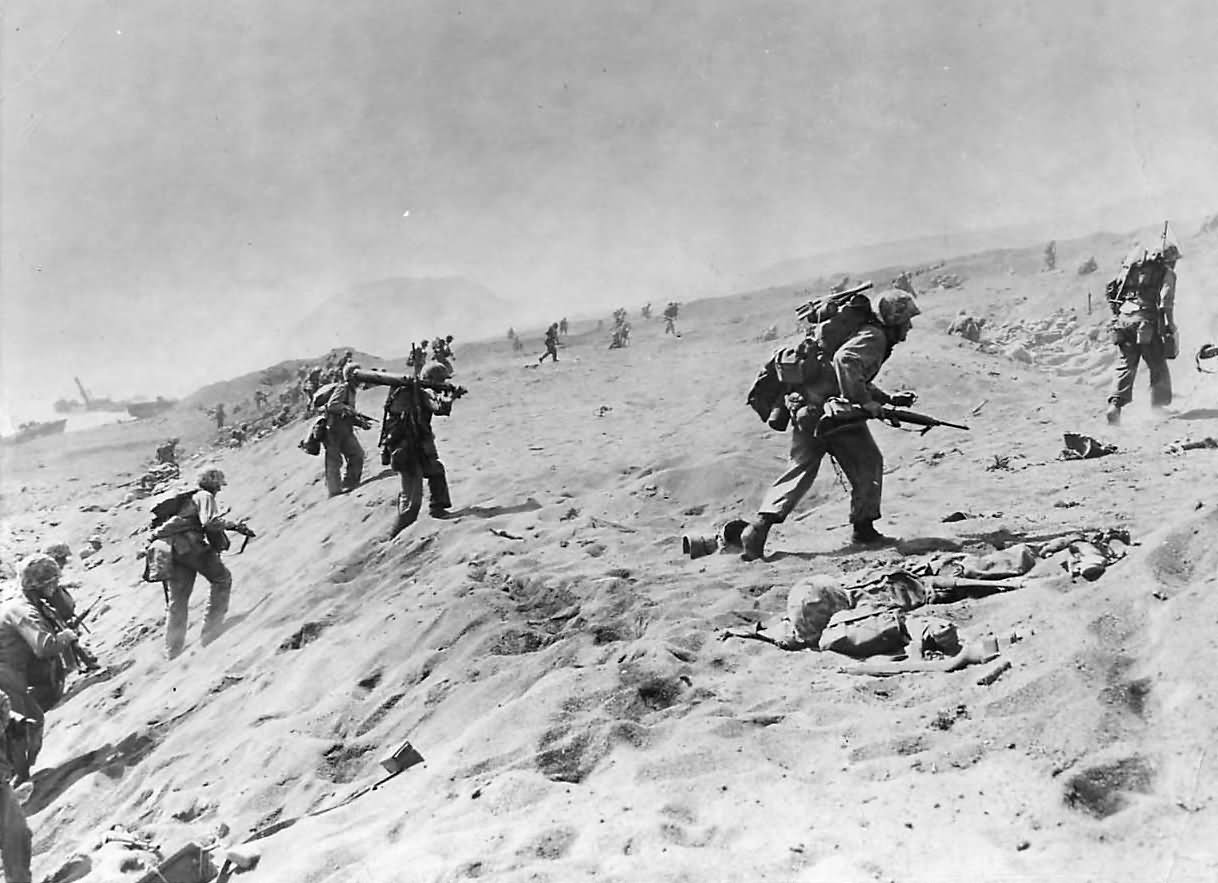 4th Division Marines move up beach on Iwo Jima