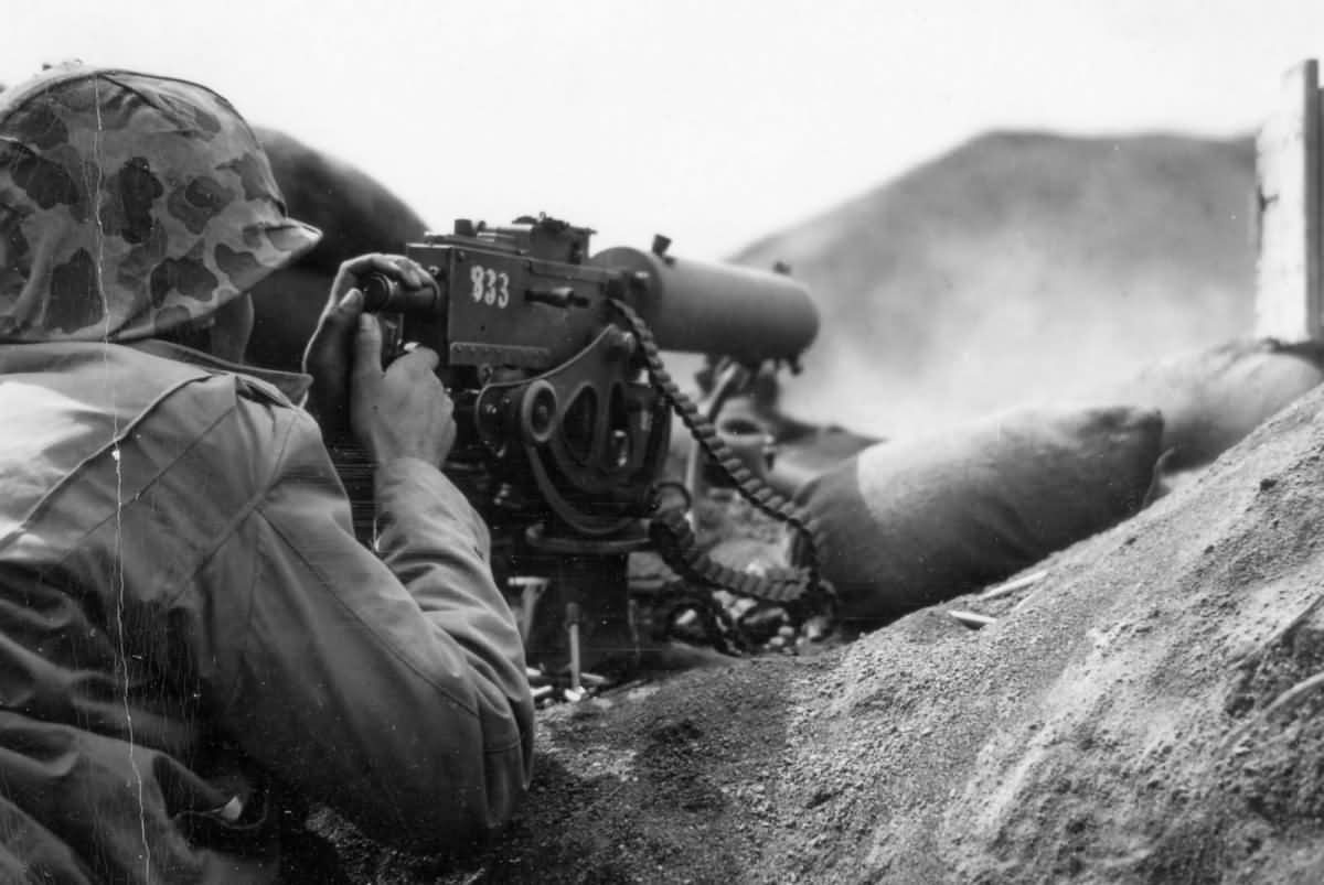 5th Marine Division 30 caliber machine gunner fires in support of an assault on Japanese positions on February 19 1945