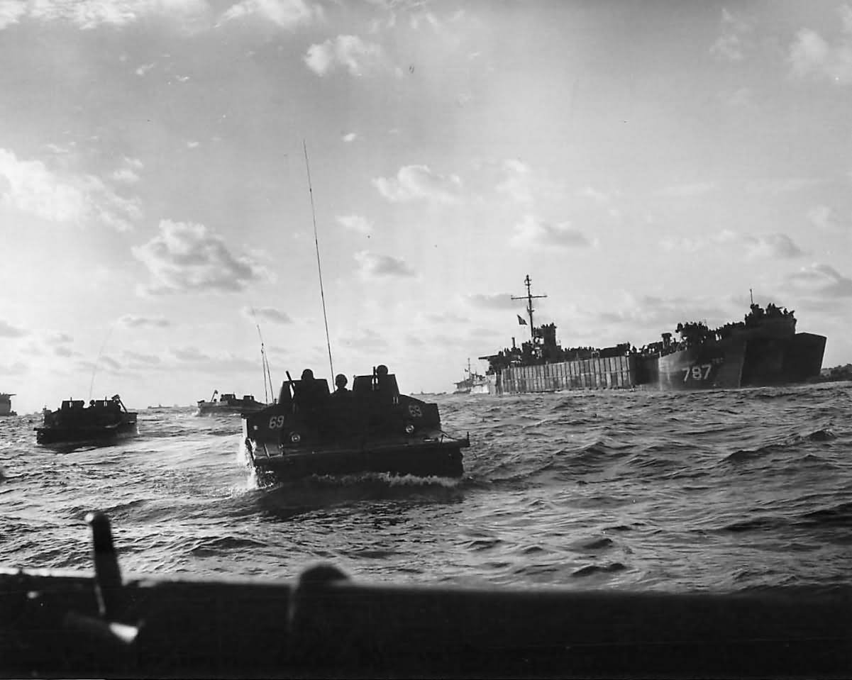 Amtracks loaded with Marines head to Iwo Jima invasion beach