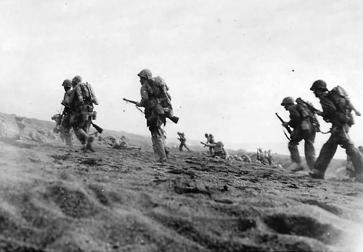 Marines advancing inland from Beach on Iwo Jima