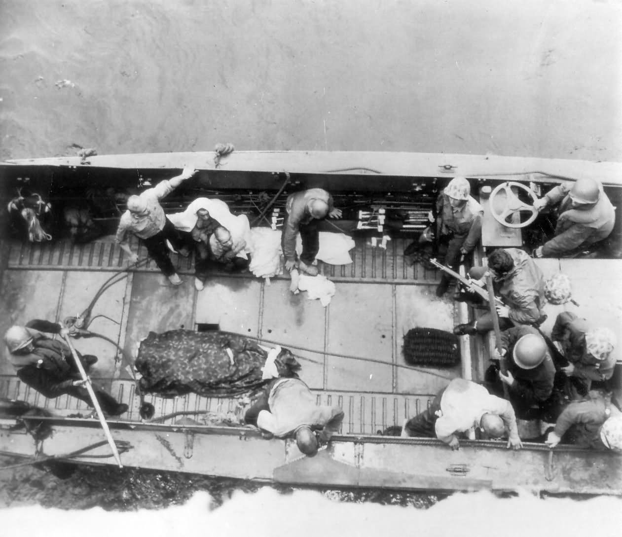 Marines and 6 Japanese Prisoners Landing Craft Iwo Jima