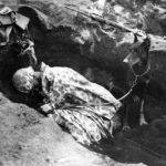Marine and doberman war dog in foxhole on Iwo Jima