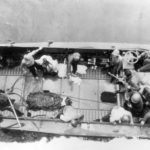 Marines and 6 Japanese Prisoners Landing Craft Iwo Jima