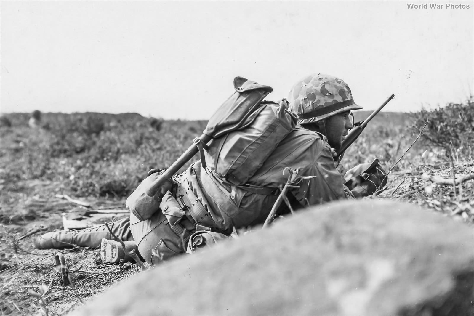 3/21 Marines crawling forward under fire at Airfield 2 Iwo Jima 24 February 1945