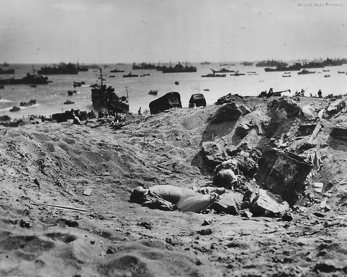 Dead Japanese lie in a shell hole on the ashy slopes below Mt Suribachi