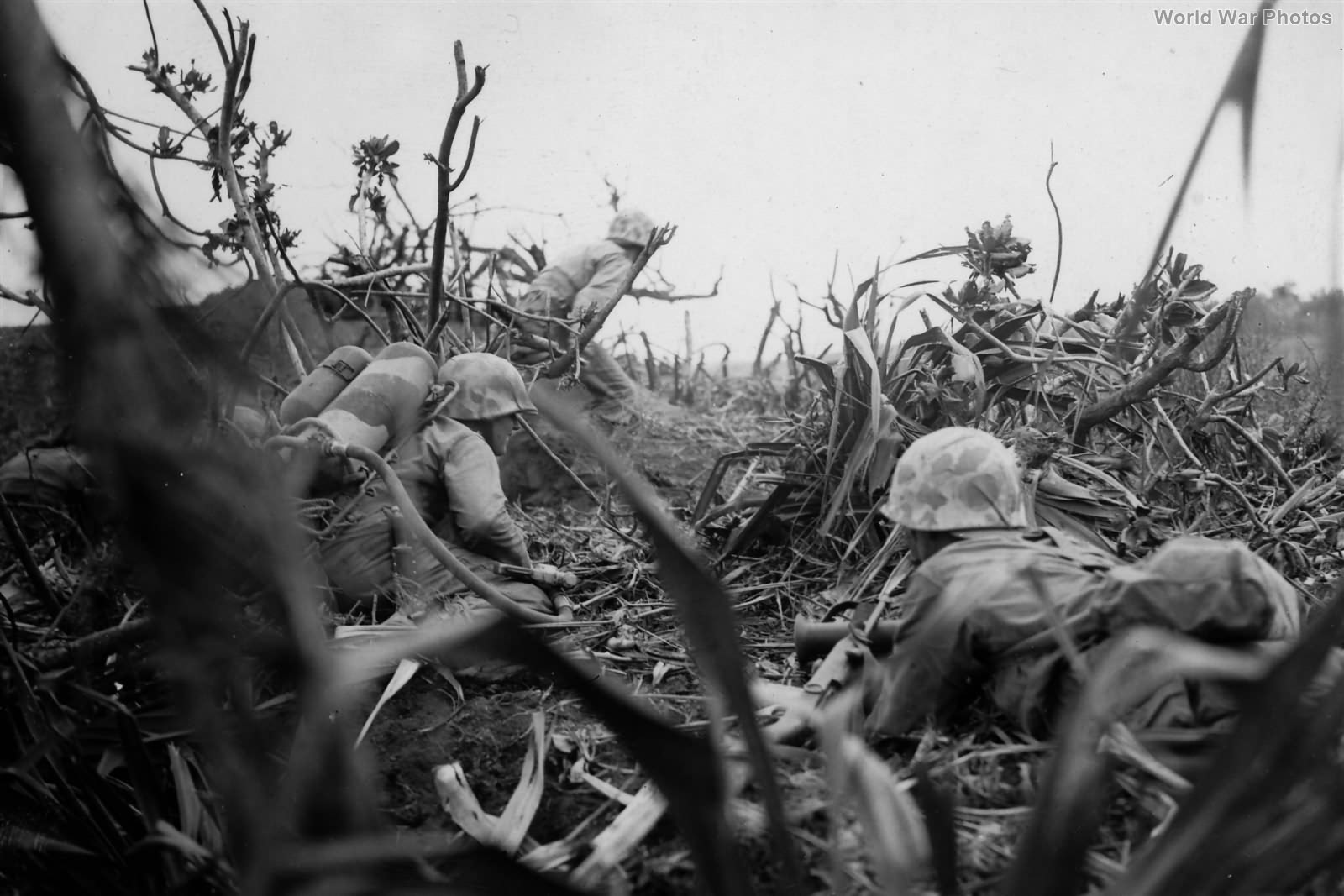 Marine flame thrower team in action on Iwo Jima 21 February 1945